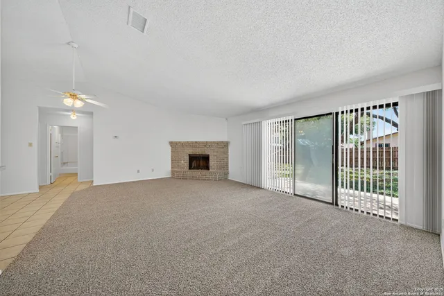 a view of empty room with floor to ceiling window