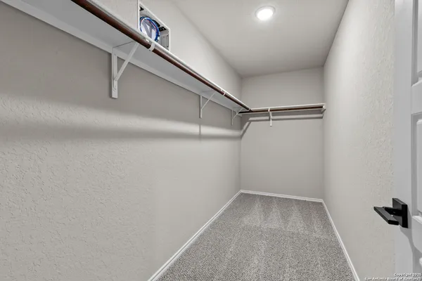 a view of a room with racks on the wall