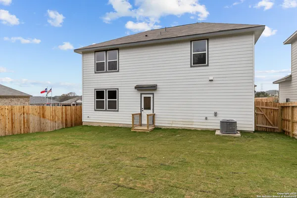 a view of a backyard of the house