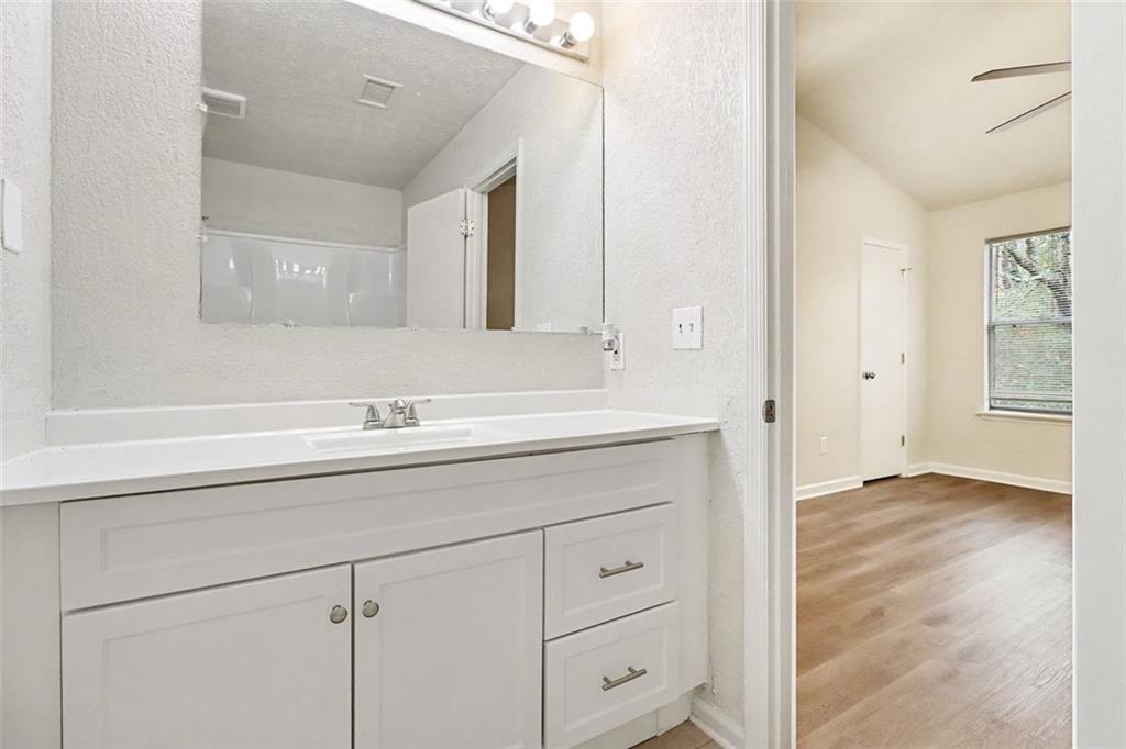 5474 Panola Downs Road Lithonia, GA 30058 - Photo 15 of 27 a bathroom with a sink and a mirror