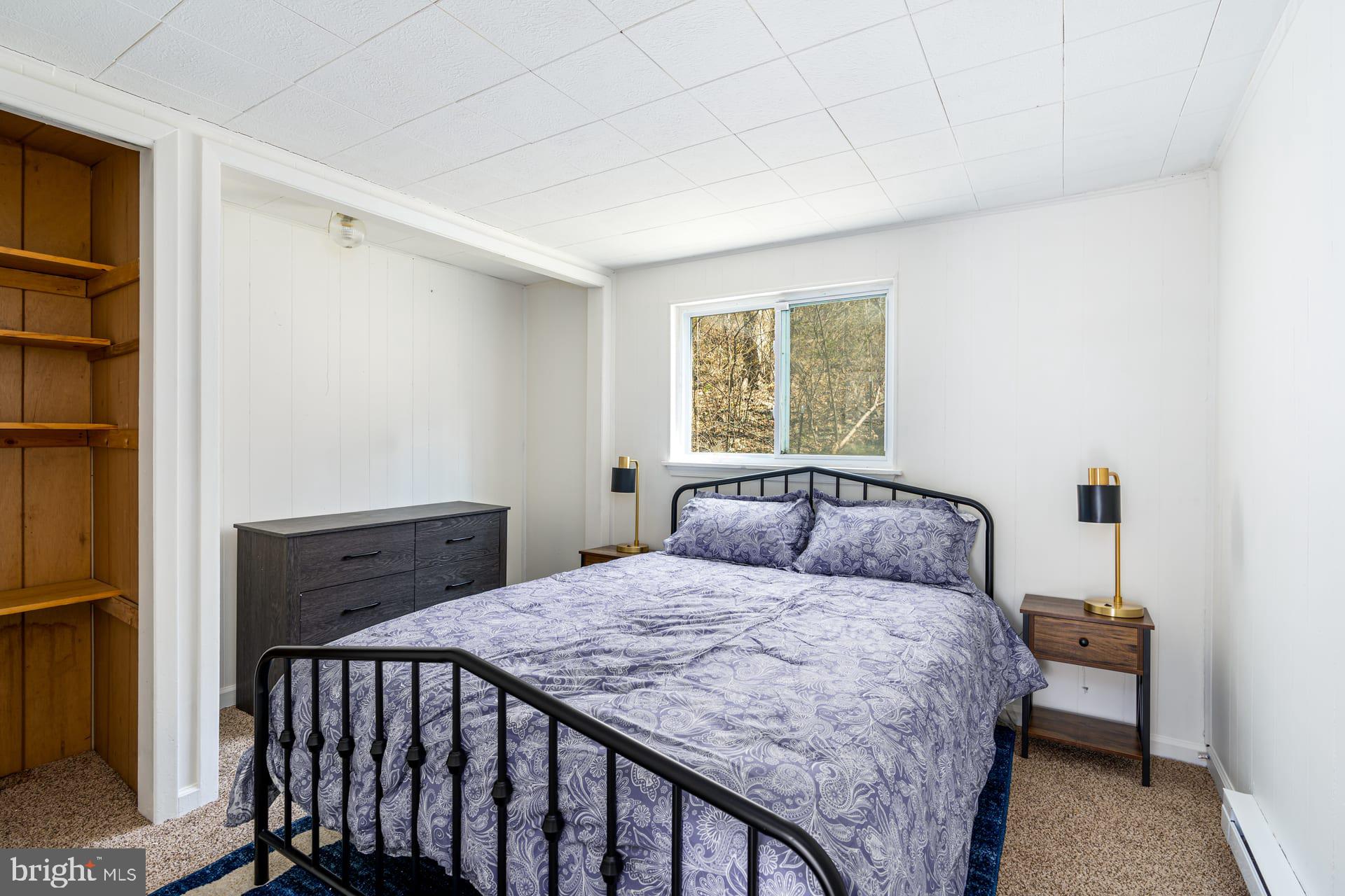 1125 Nancy Jack Road Gerrardstown, WV 25420 - Photo 16 of 24 a bedroom with a bed and a window