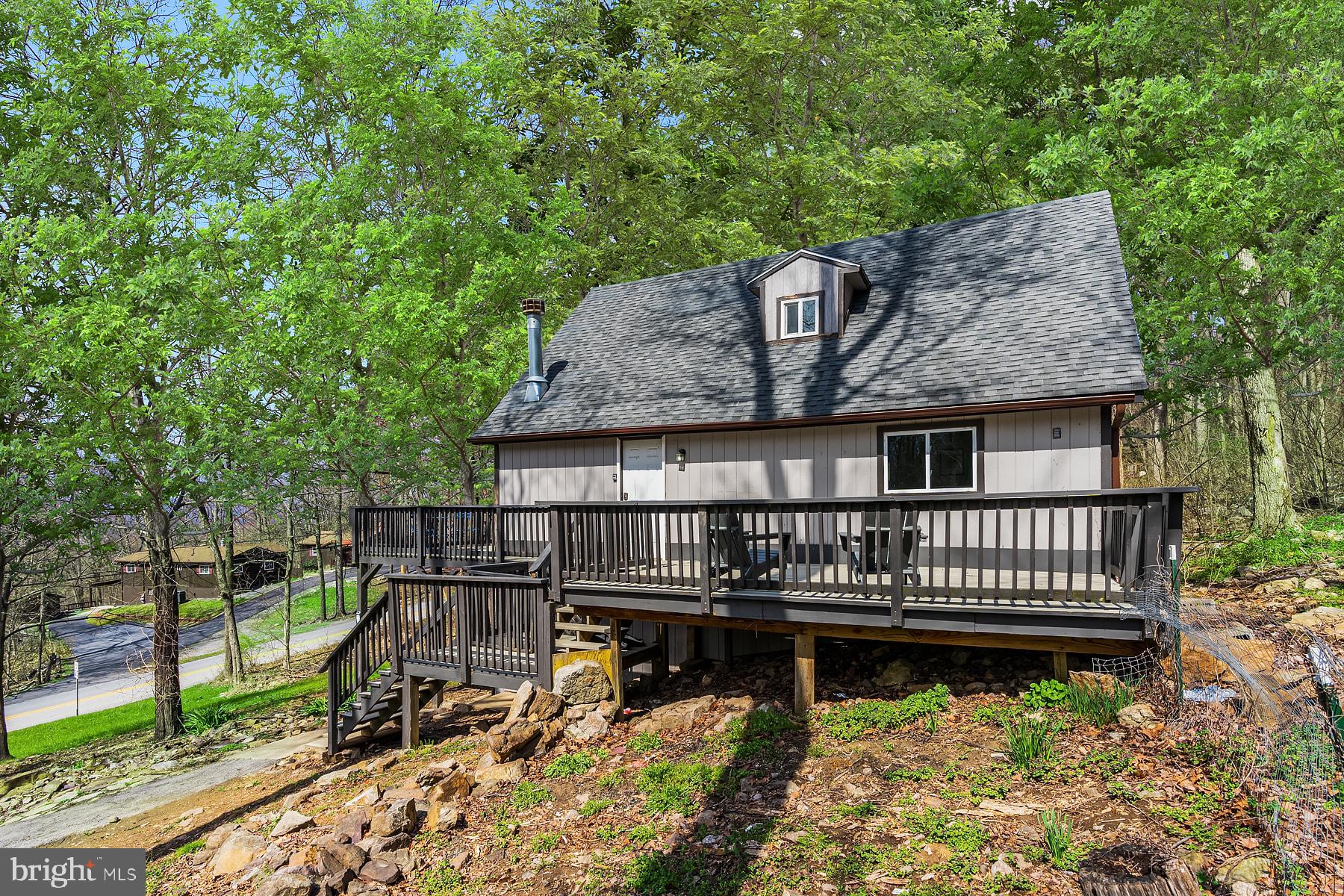 1125 Nancy Jack Road Gerrardstown, WV 25420 - Photo 22 of 24 a view of a wooden deck with a bench