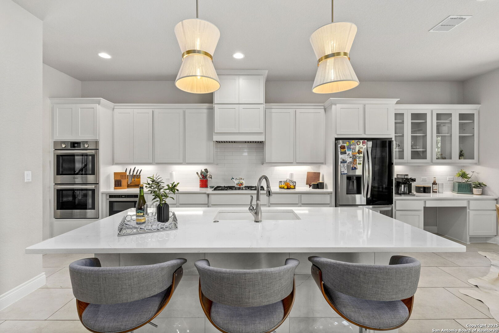 18323 Powder San Antonio, TX 78257 - Photo 12 of 42 a kitchen with stainless steel appliances granite countertop a sink a stove and a refrigerator