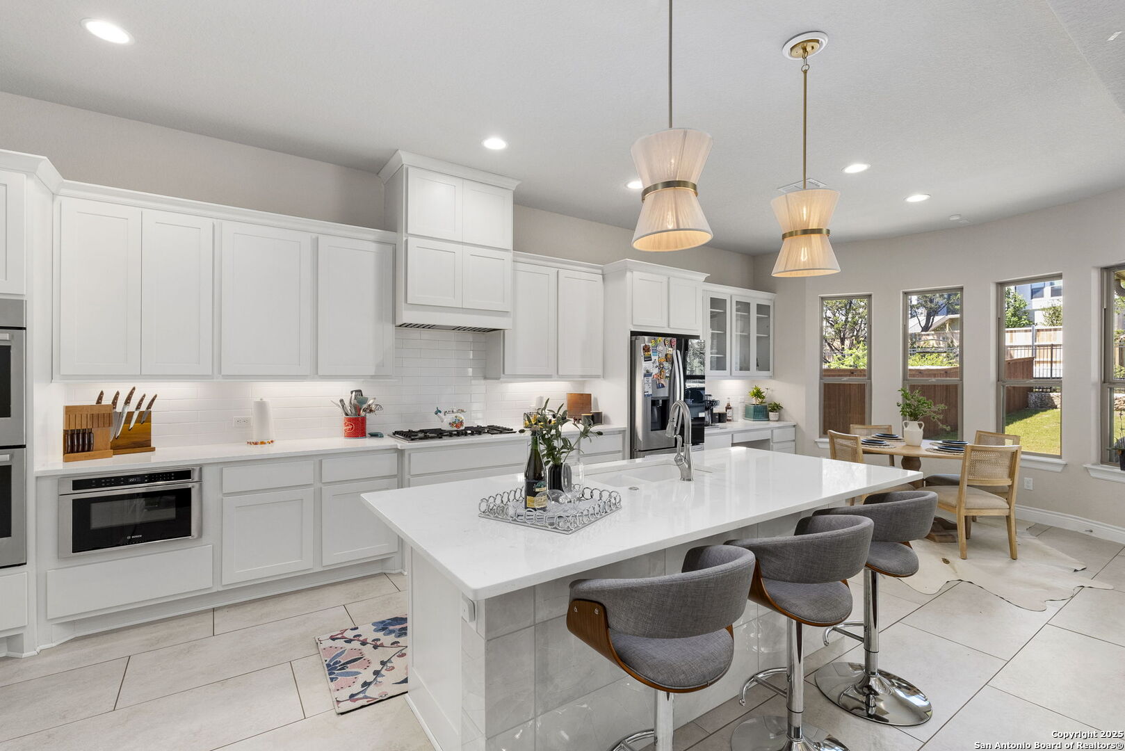 18323 Powder San Antonio, TX 78257 - Photo 14 of 42 a kitchen with stainless steel appliances a table and chairs in it
