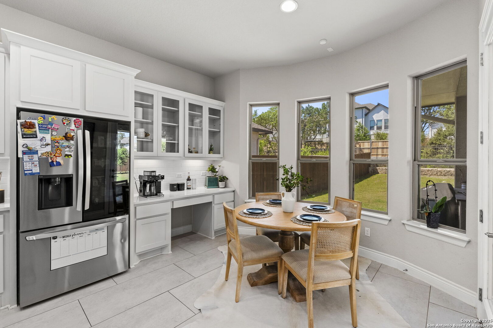 18323 Powder San Antonio, TX 78257 - Photo 16 of 42 a kitchen with a dining table and chairs