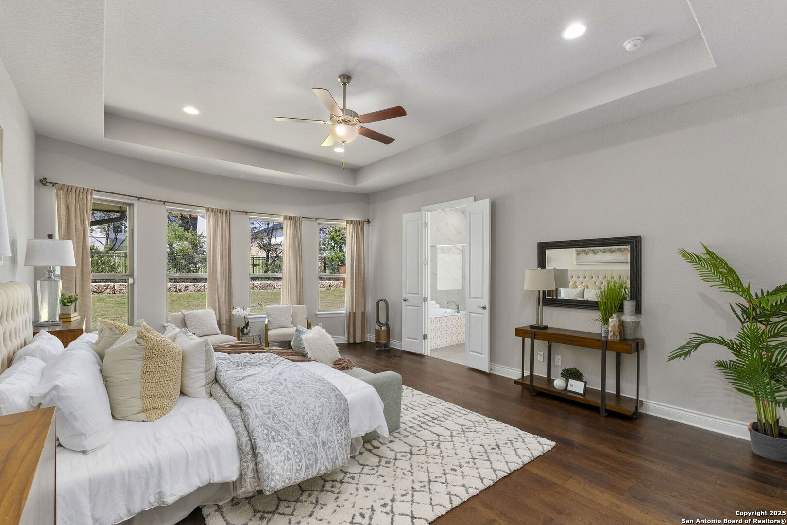 18323 Powder San Antonio, TX 78257 - Photo 22 of 42 a bedroom with a bed a chandelier and a large window