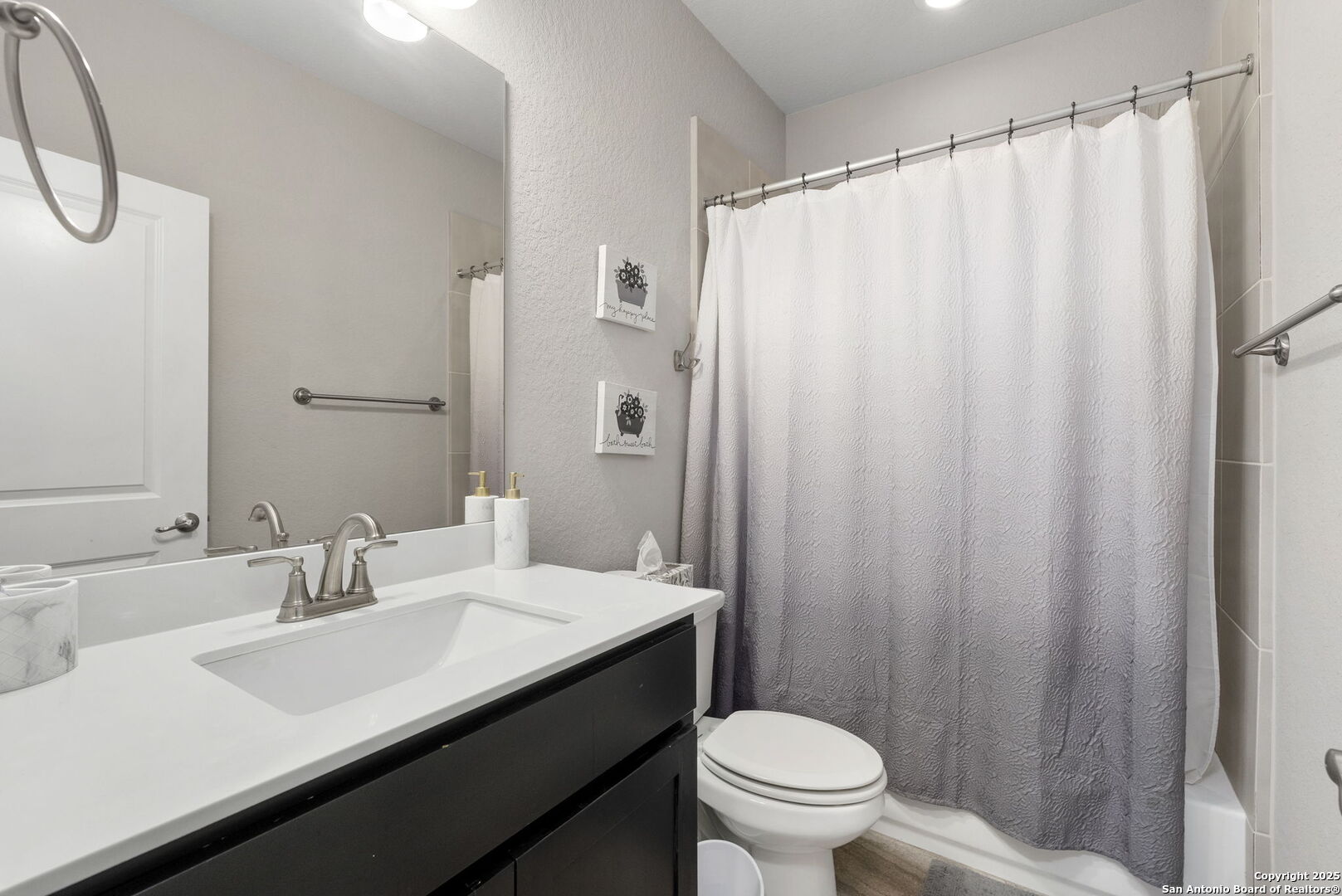 18323 Powder San Antonio, TX 78257 - Photo 29 of 42 a bathroom with a sink a toilet and shower curtain