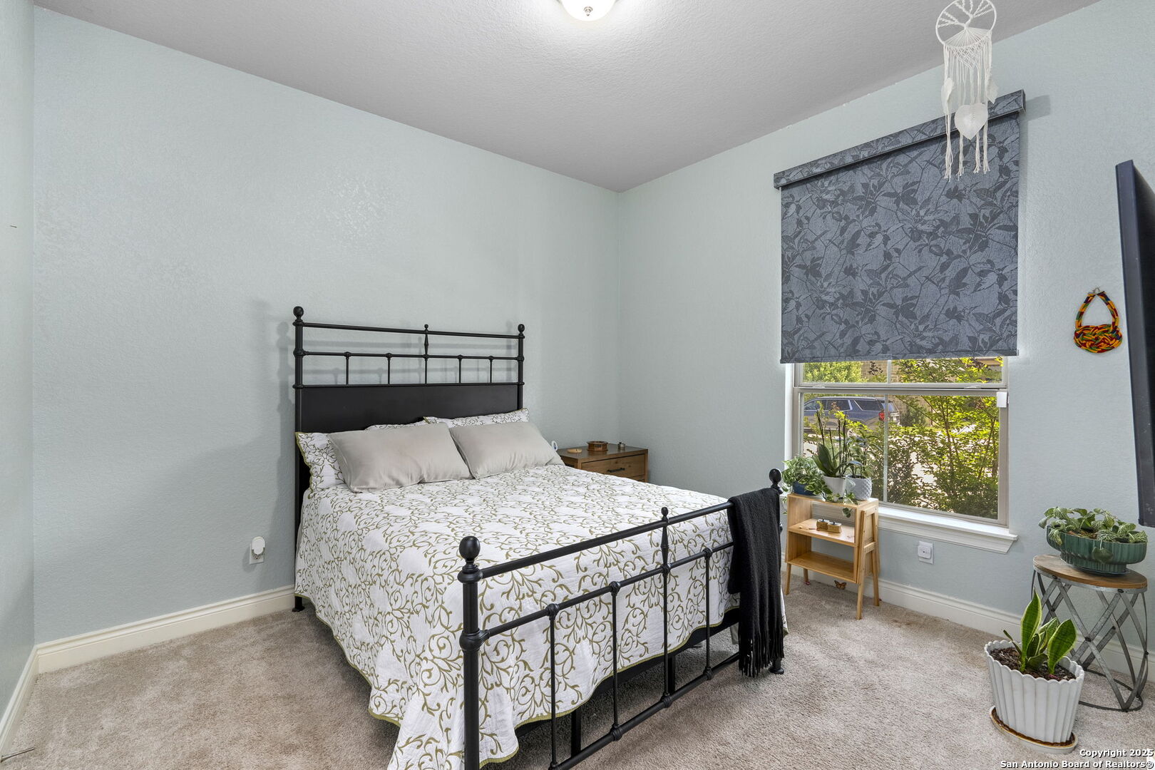 18323 Powder San Antonio, TX 78257 - Photo 32 of 42 a bedroom with a bed and a window