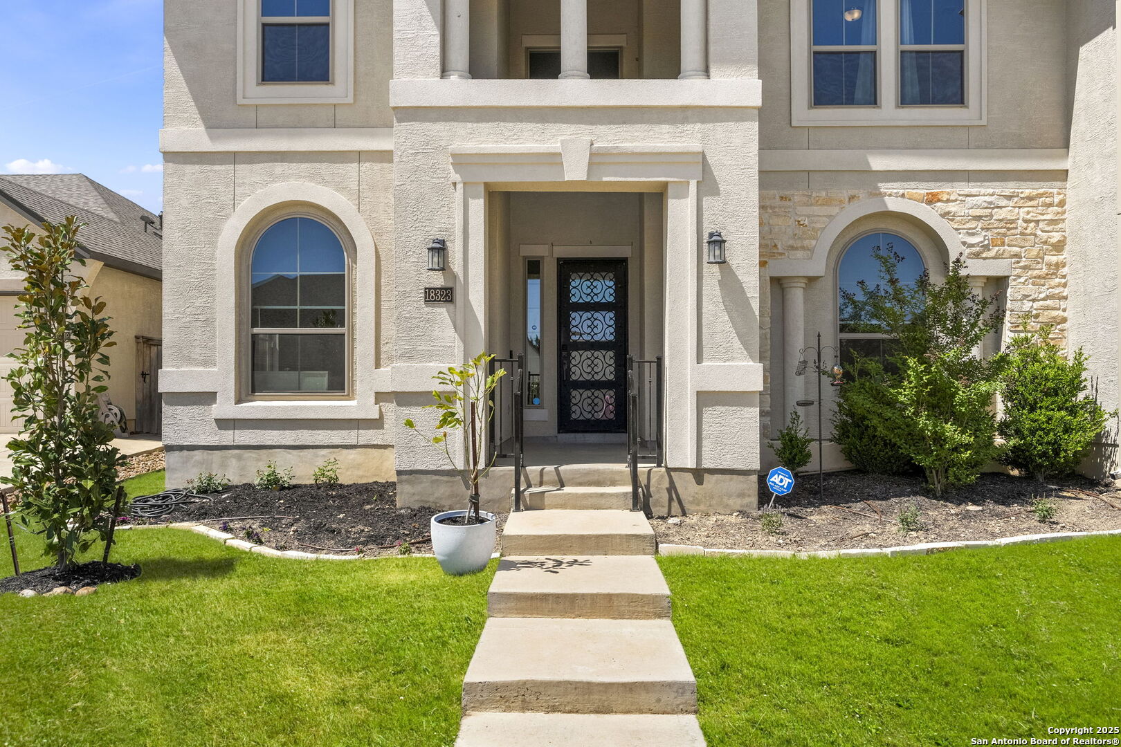 18323 Powder San Antonio, TX 78257 - Photo 7 of 42 a front view of a house with a garden