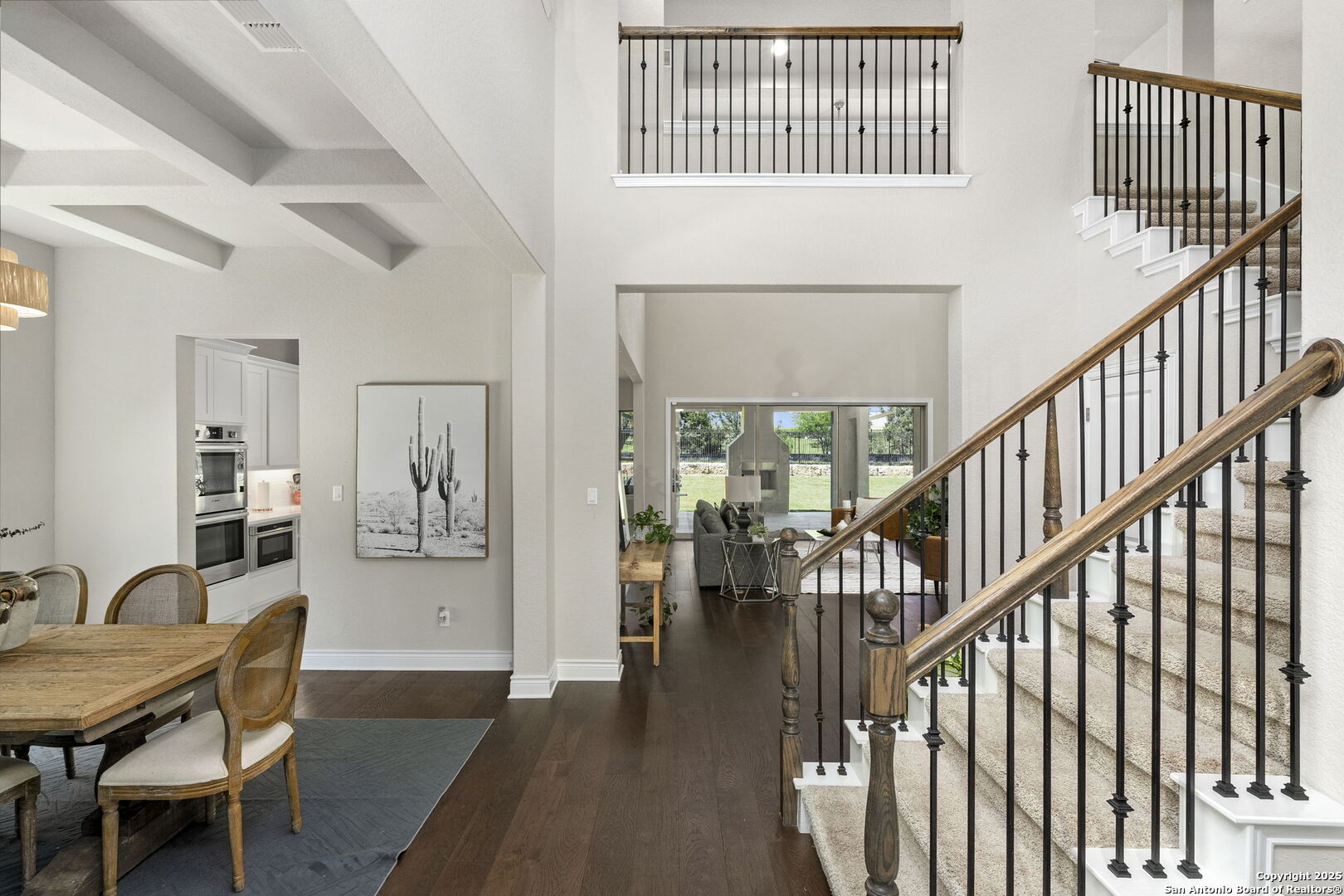 18323 Powder San Antonio, TX 78257 - Photo 10 of 42 a view of a dining room with furniture wooden floor and floor to ceiling window