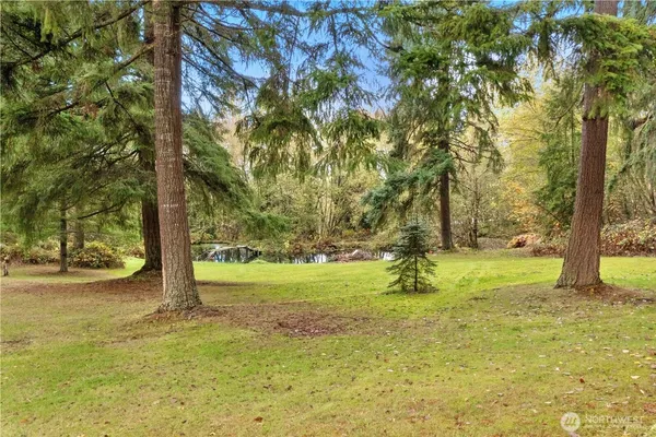a backyard of a house with lots of green space