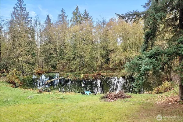 a view of a golf course with trees