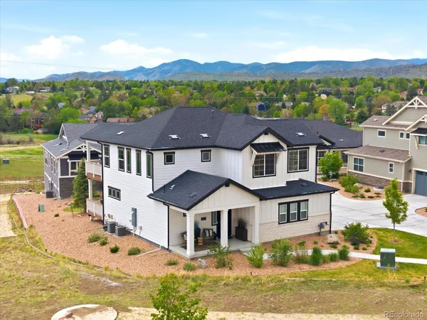 an aerial view of a house with a big yard