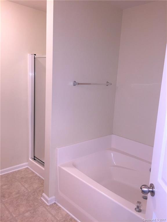 2137 Midnight Blue Lane, Unit 186 Fort Mill, SC 29708 - Photo 11 of 14 a bathroom with a bathtub