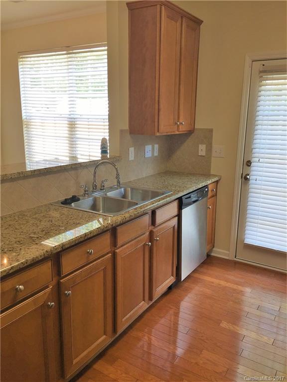 2137 Midnight Blue Lane, Unit 186 Fort Mill, SC 29708 - Photo 3 of 14 a kitchen with stainless steel appliances granite countertop a sink cabinets and a window