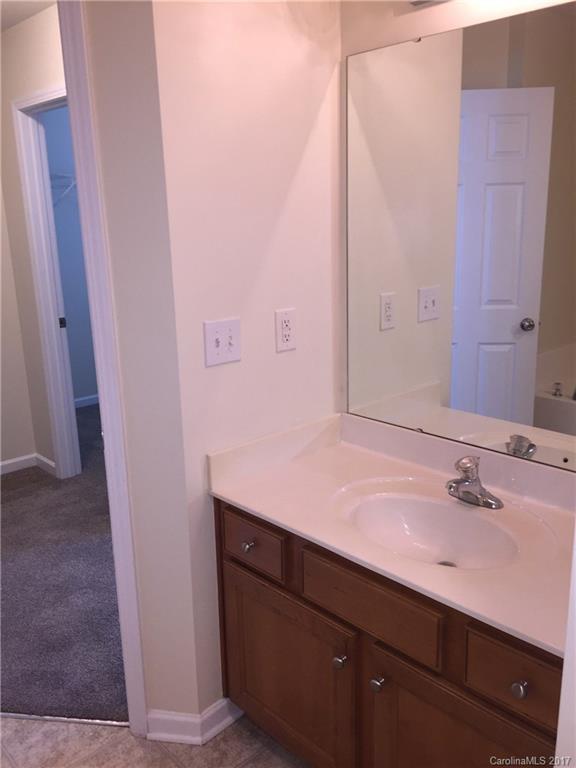 2137 Midnight Blue Lane, Unit 186 Fort Mill, SC 29708 - Photo 10 of 14 a bathroom with a sink and a mirror