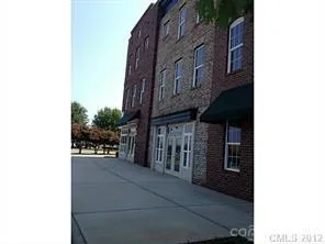 a view of a street with sitting area
