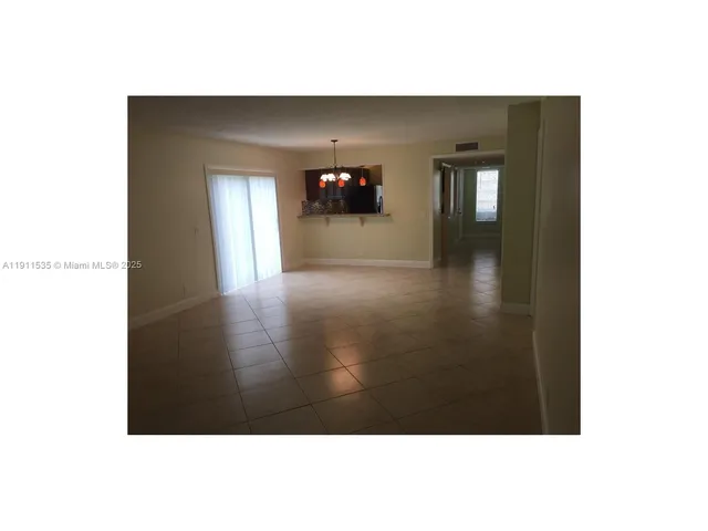 a view of a big room with windows