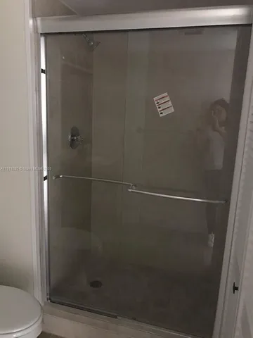 a picture of a living room with a bench