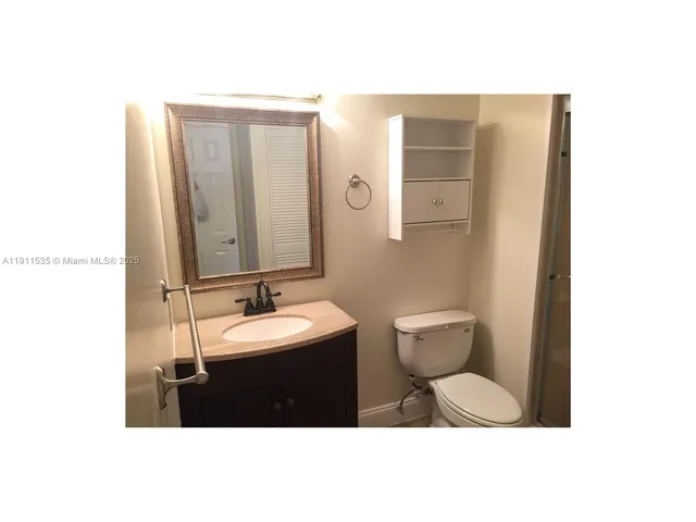 a picture of a bathroom with a sink