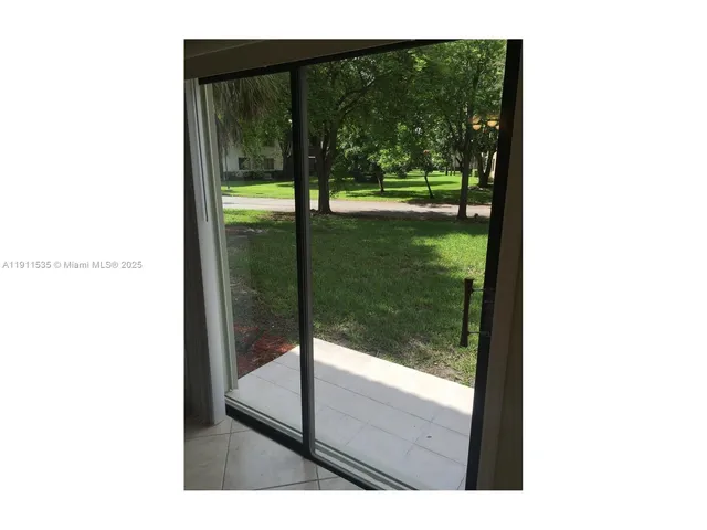 a view of a porch with a yard