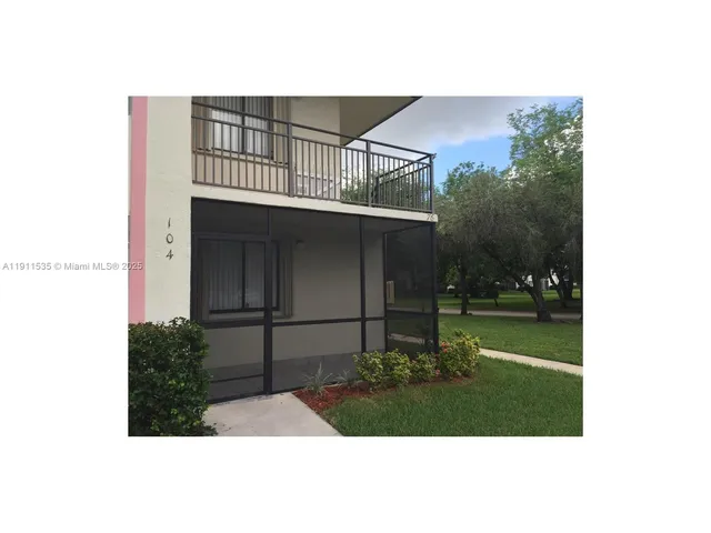 a view of living room with a large mirror