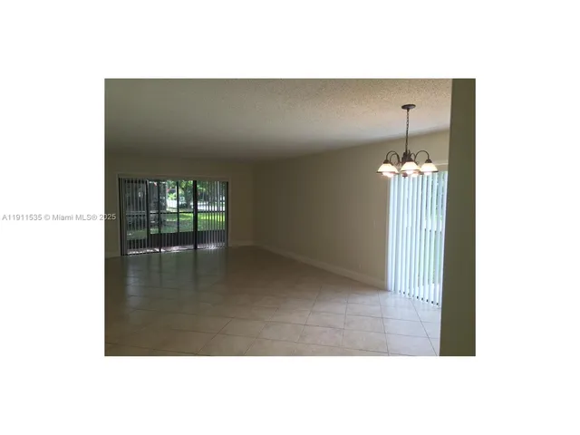 a view of a hallway with stairs