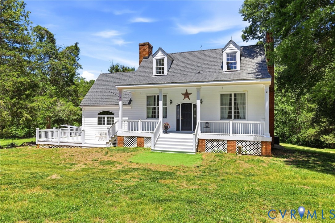 3355 Duke Road Powhatan, VA 23139 - Photo 36 of 67 a front view of a house with a yard table and chairs