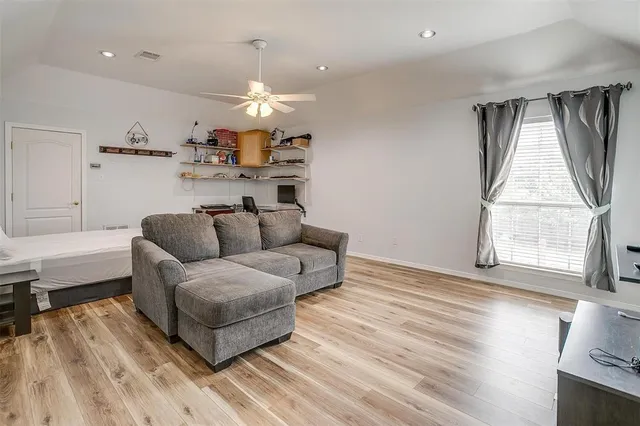swimming pool view with a seating space