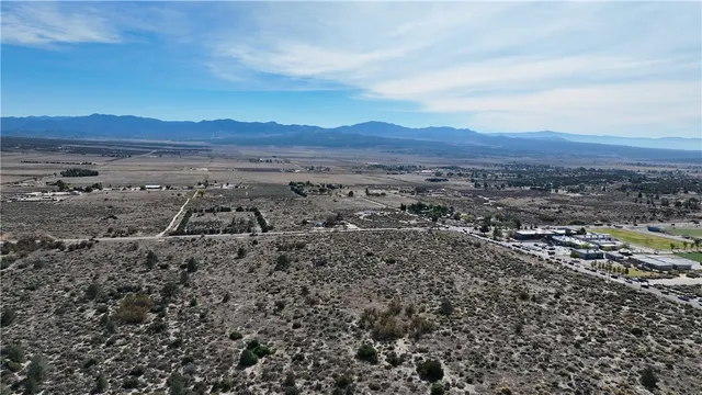 an aerial view of residential house and green space