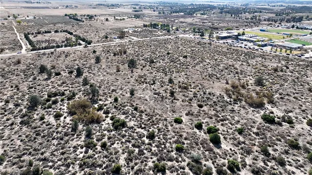 an aerial view of house with a yard