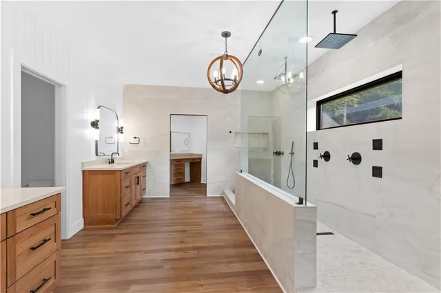 a kitchen with granite countertop a stove sink and cabinets