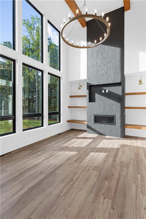 4 Cox Road Woodstock, GA 30188 - Photo 16 of 22 a view of a livingroom with wooden floor and a fireplace