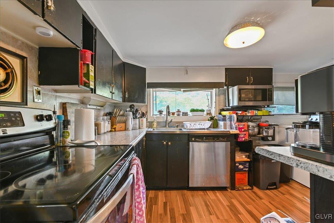 1324 Main Street Northampton, PA 18067 - Photo 21 of 49 a kitchen with stainless steel appliances granite countertop a stove and a sink