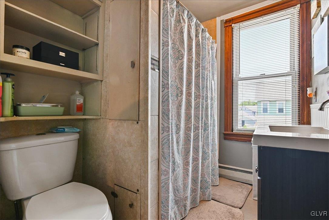 1324 Main Street Northampton, PA 18067 - Photo 30 of 49 a bathroom with a toilet a sink and a window