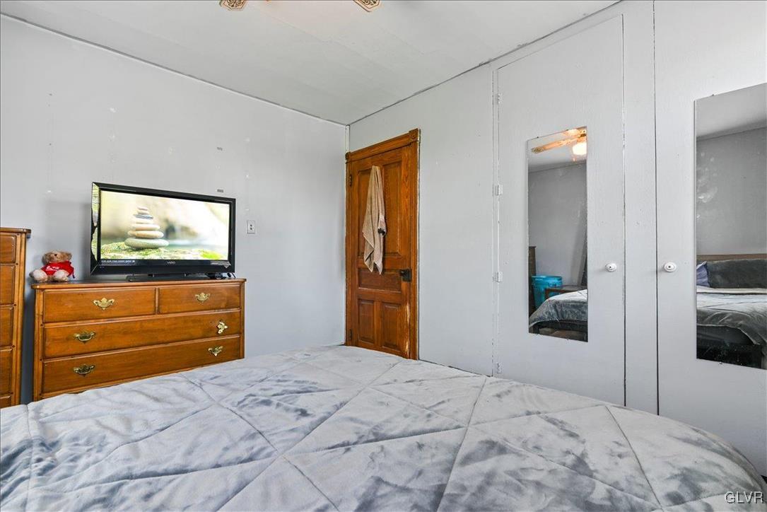 1324 Main Street Northampton, PA 18067 - Photo 32 of 49 a bedroom with a bed and a flat screen tv