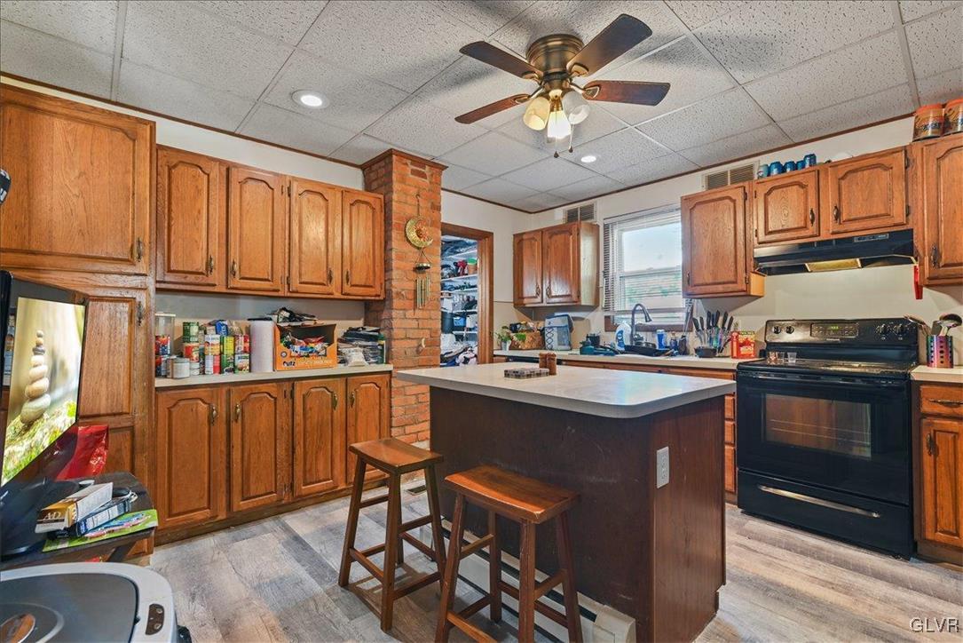 1324 Main Street Northampton, PA 18067 - Photo 38 of 49 a kitchen with stainless steel appliances granite countertop a stove cabinets and entryway
