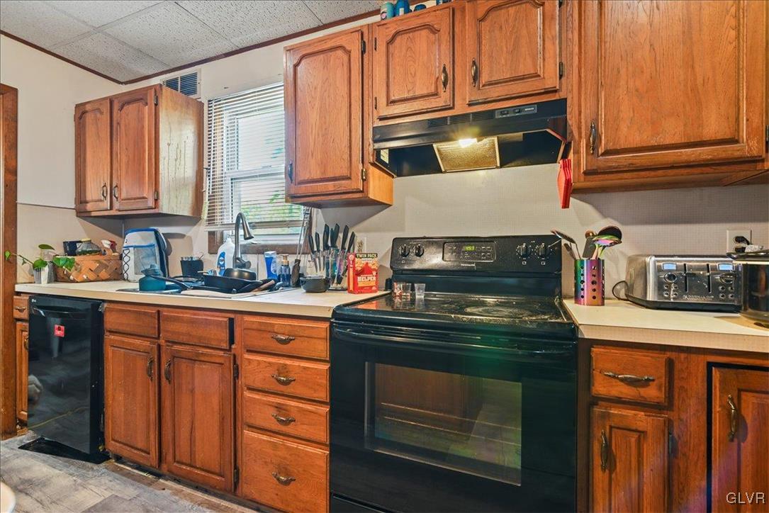 1324 Main Street Northampton, PA 18067 - Photo 39 of 49 a kitchen with stainless steel appliances granite countertop a stove and cabinets