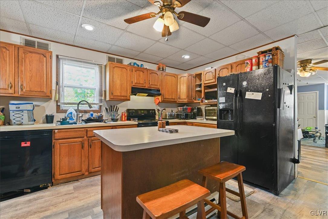 1324 Main Street Northampton, PA 18067 - Photo 40 of 49 a kitchen with stainless steel appliances granite countertop a sink refrigerator and cabinets