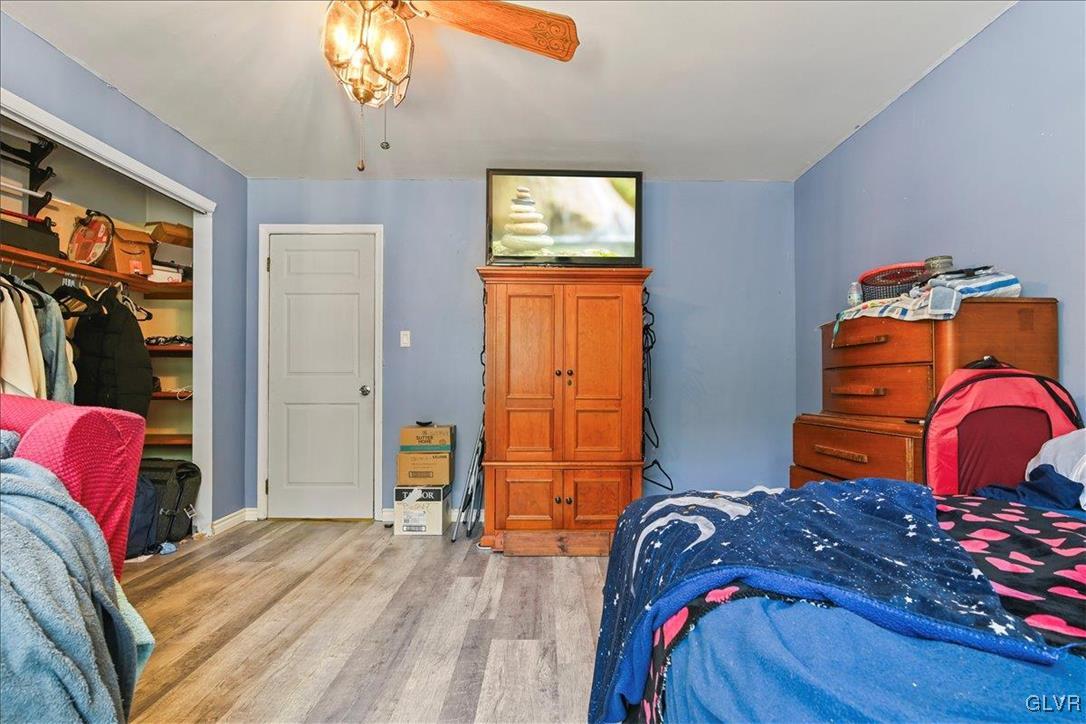 1324 Main Street Northampton, PA 18067 - Photo 45 of 49 a bedroom with a bed and a chandelier