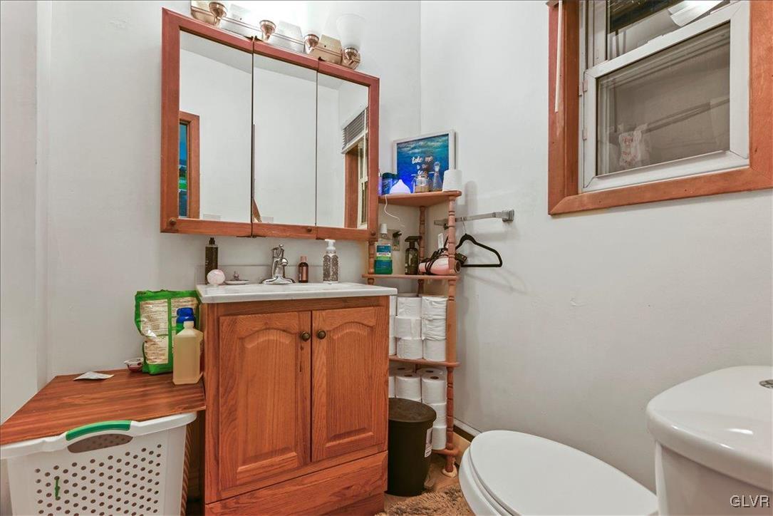 1324 Main Street Northampton, PA 18067 - Photo 47 of 49 a bathroom with a toilet a sink and a mirror