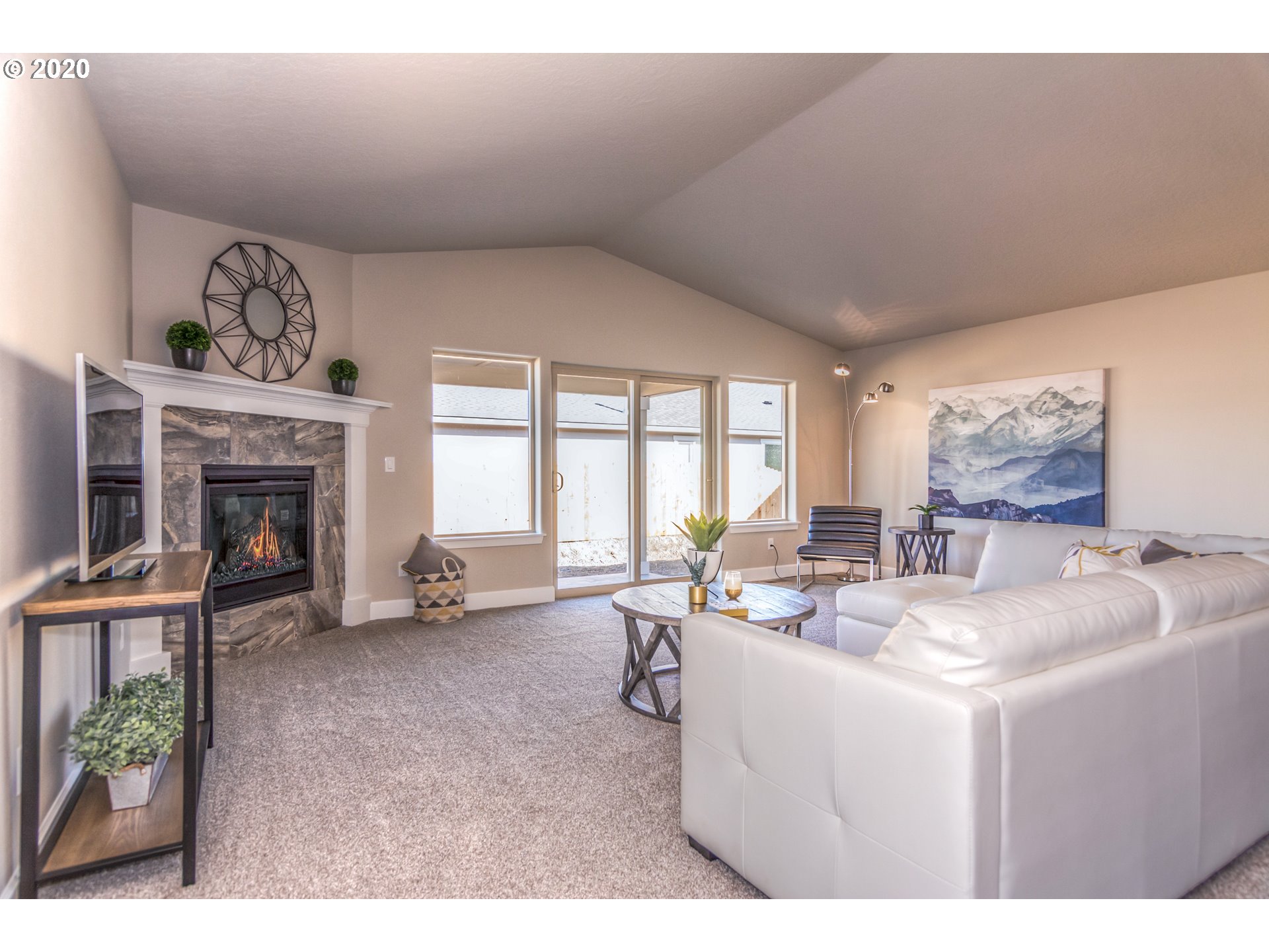 475 South 10th Street Monroe, OR 97456 - Photo 20 of 24 a living room with furniture a window and a fireplace