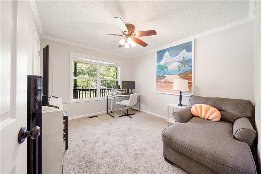 921 Pace Road Hiram, GA 30141 - Photo 22 of 41 a living room with furniture and a large window