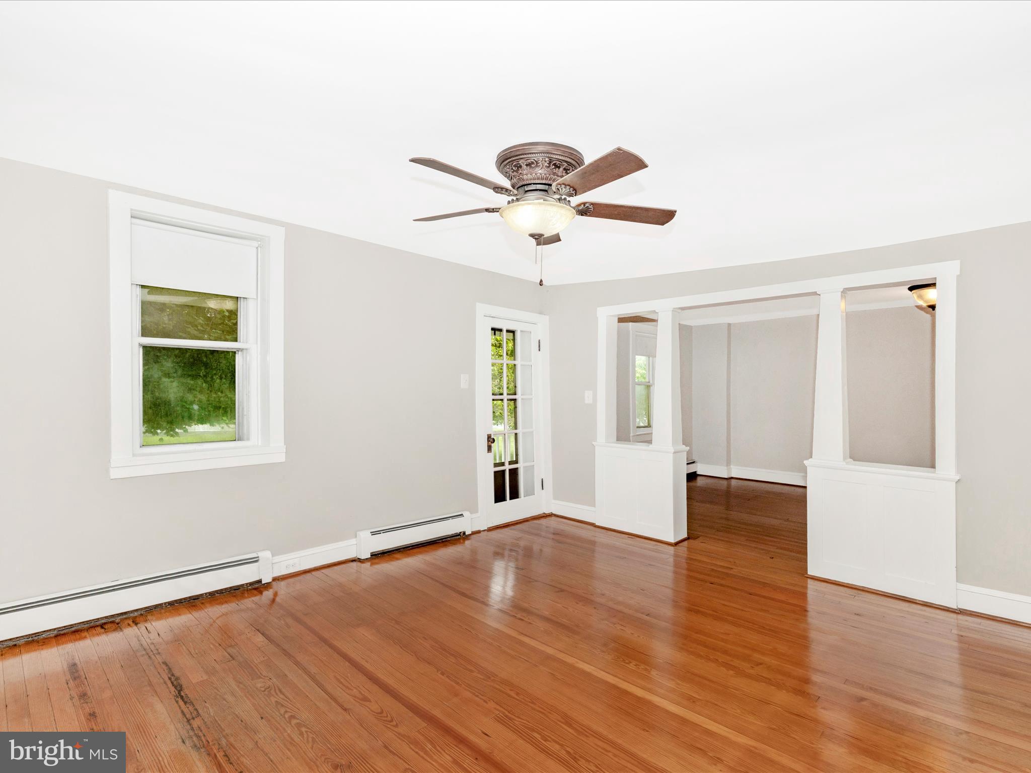 12261 Baugher Road Thurmont, MD 21788 - Photo 17 of 61 a view of an empty room with a window and wooden floor