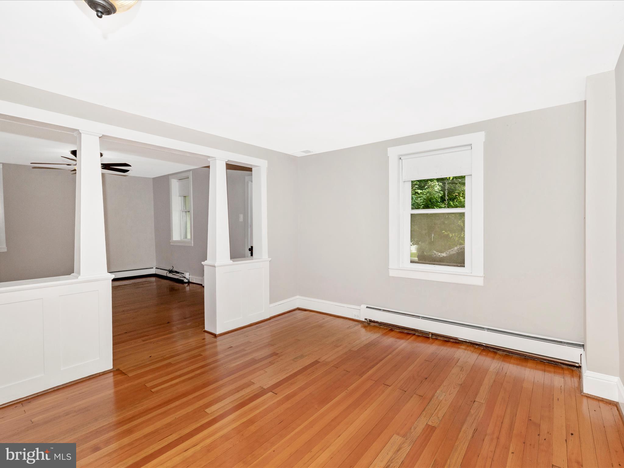 12261 Baugher Road Thurmont, MD 21788 - Photo 20 of 61 an empty room with wooden floor and windows
