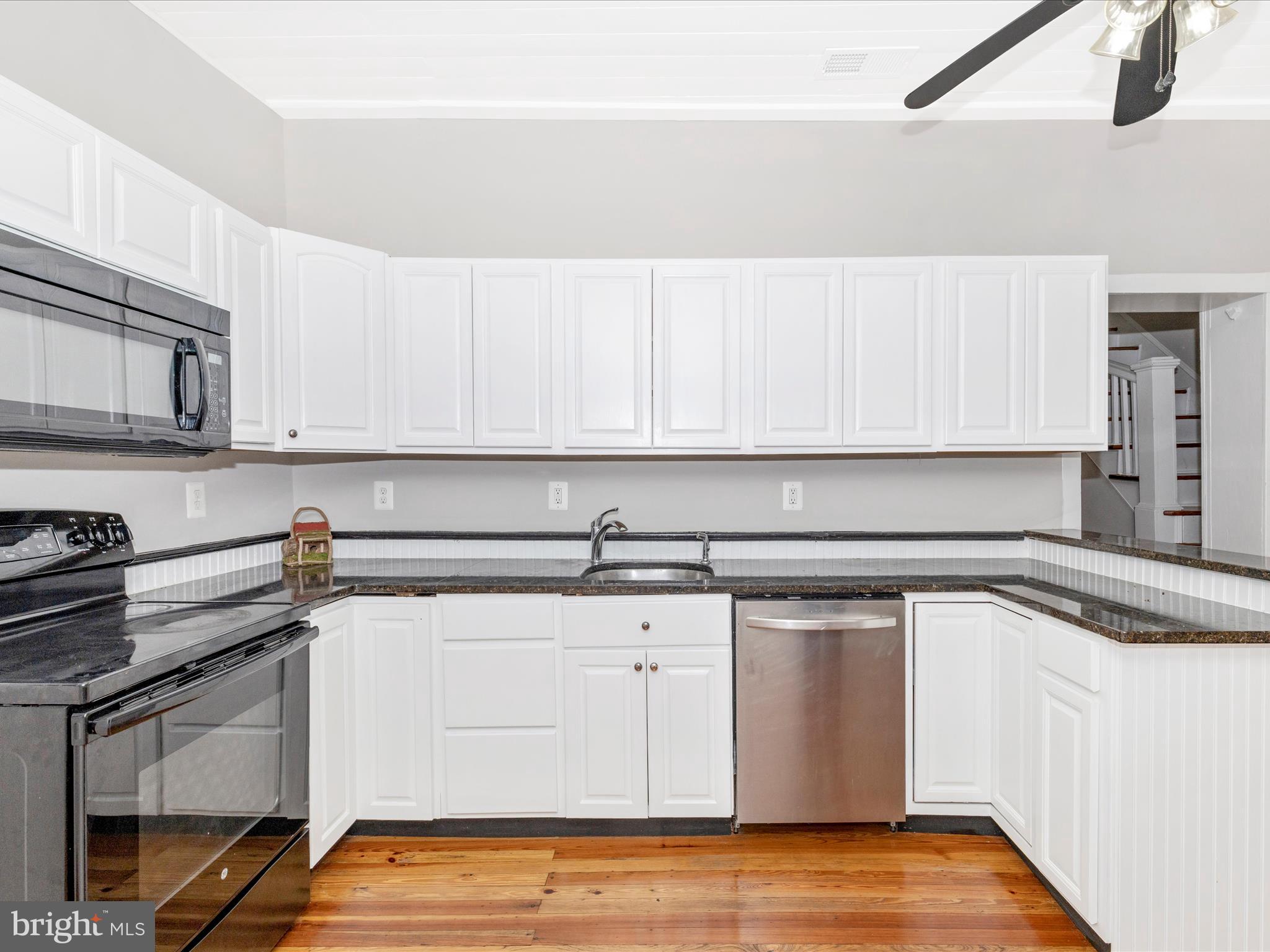12261 Baugher Road Thurmont, MD 21788 - Photo 28 of 61 a kitchen with a sink and cabinets