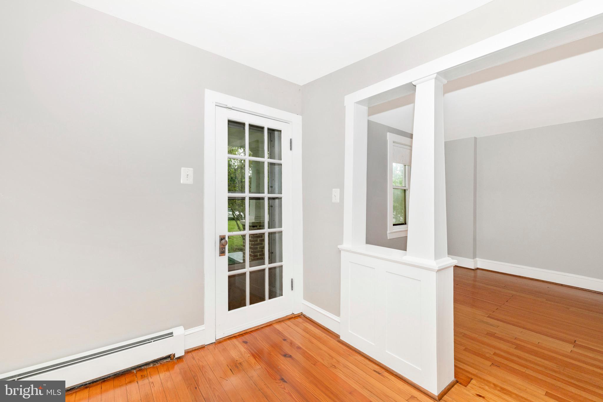 12261 Baugher Road Thurmont, MD 21788 - Photo 3 of 61 an empty room with wooden floor and windows