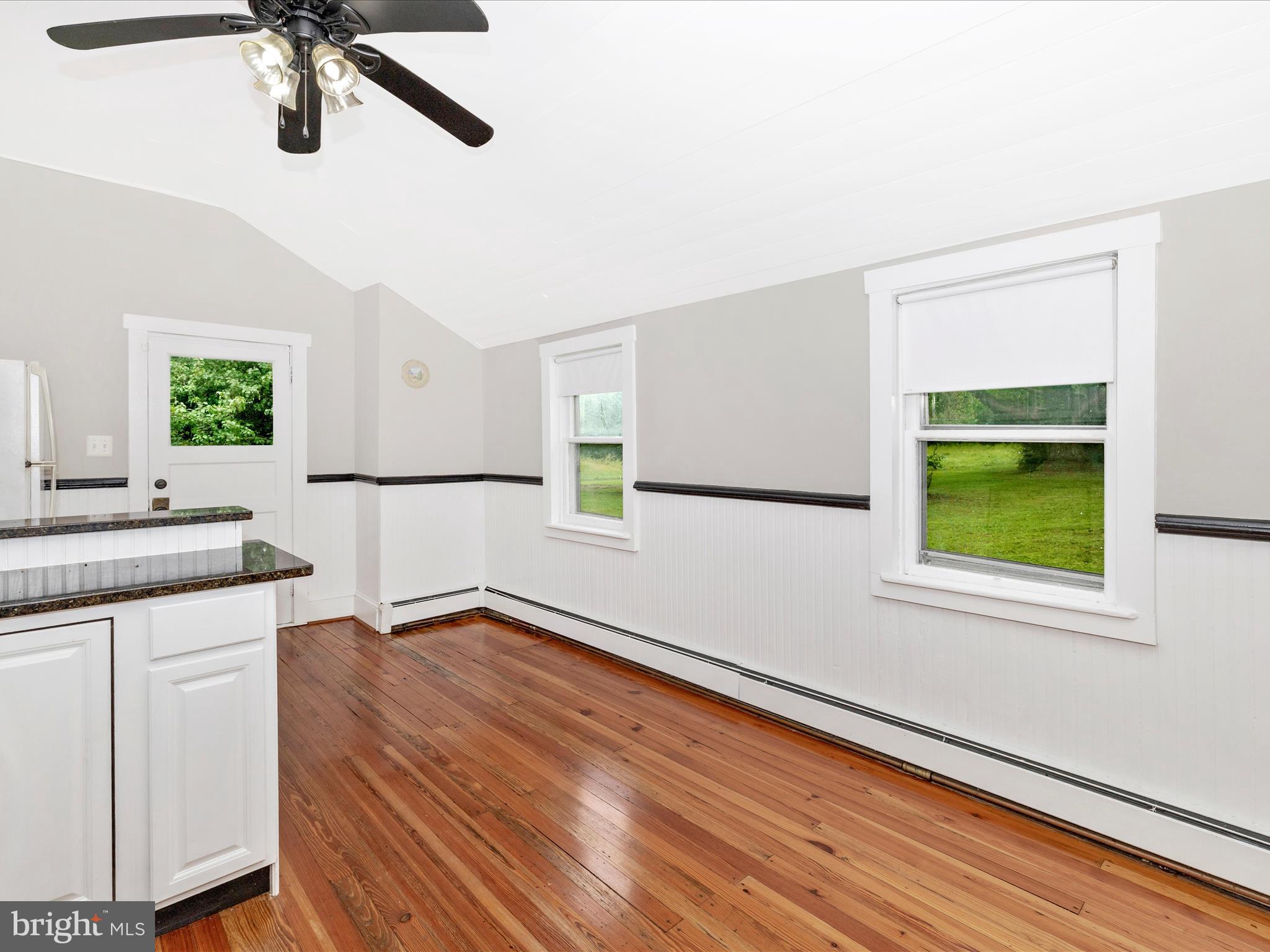 12261 Baugher Road Thurmont, MD 21788 - Photo 31 of 61 a view of an empty room with a window and wooden floor