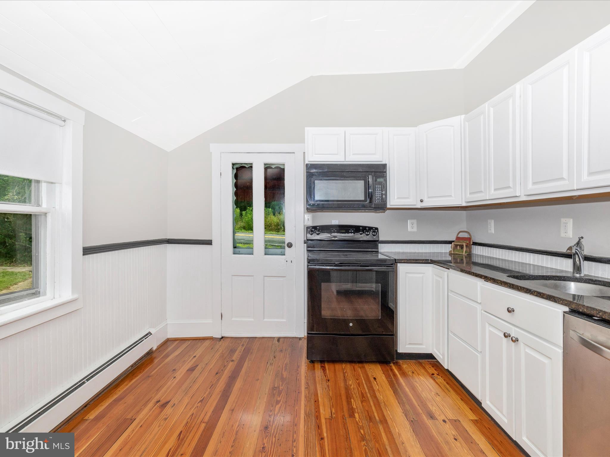 12261 Baugher Road Thurmont, MD 21788 - Photo 32 of 61 a kitchen with granite countertop a sink cabinets and stainless steel appliances
