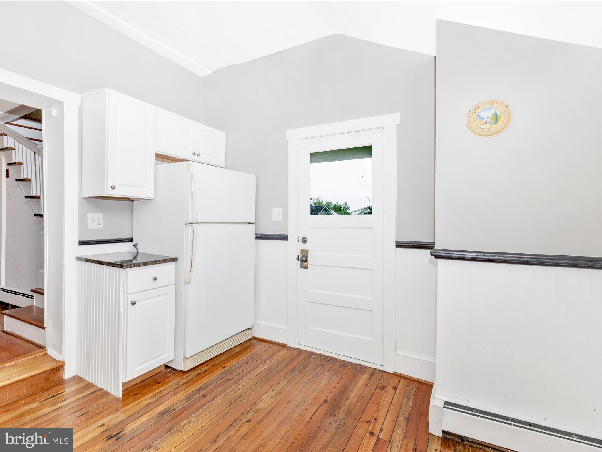 12261 Baugher Road Thurmont, MD 21788 - Photo 33 of 61 a kitchen with a refrigerator and a stove